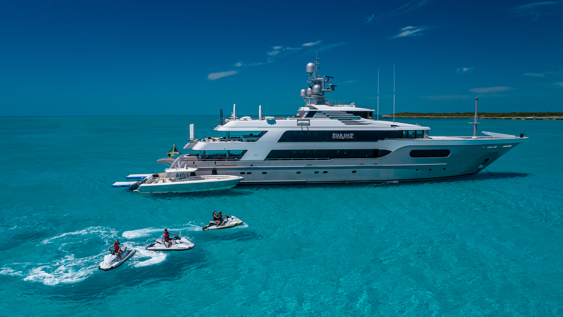 Superyacht STARSHIP 185' Delta Marine at anchor with yacht toys and jet skis